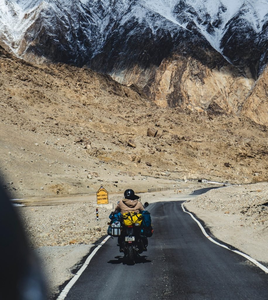 Is it safe for bikers to ride in cold weather without gloves or long sleeves-hero Image